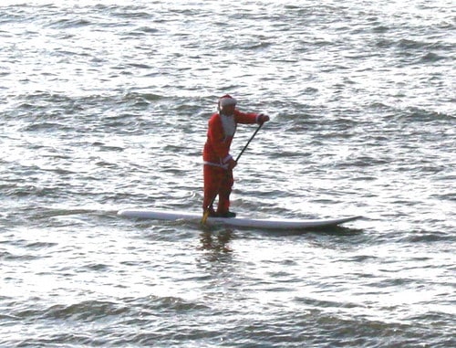 paddle boarding Santa